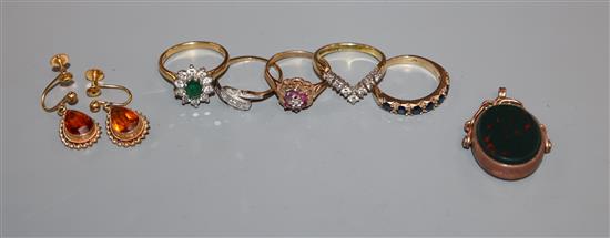 Two 18ct gold gem set rings including diamond, three 9ct gold and gem set rings, a gold fob and pair of 9ct ear clips.